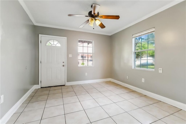 entryway featuring ornamental molding, ceiling fan, light tile patterned floors, and plenty of natural light