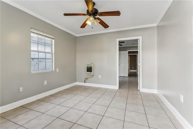 tiled spare room featuring ceiling fan, ornamental molding, and heating unit