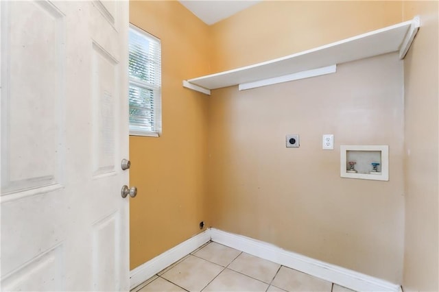 laundry room with hookup for an electric dryer, washer hookup, and light tile patterned floors