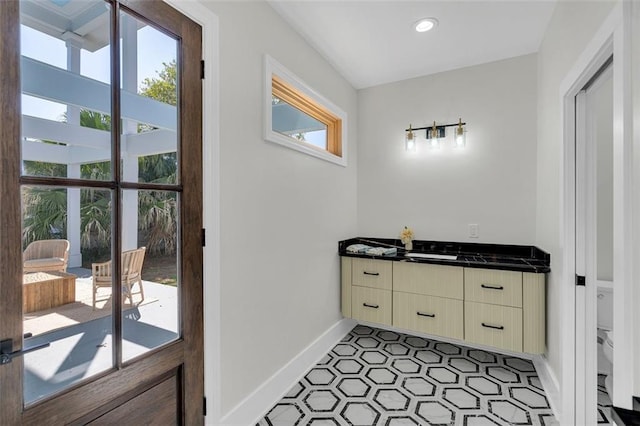 bathroom with toilet and a healthy amount of sunlight