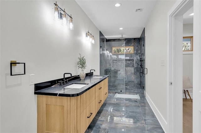 bathroom featuring vanity and walk in shower