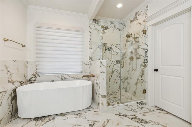 bathroom featuring ornamental molding and separate shower and tub