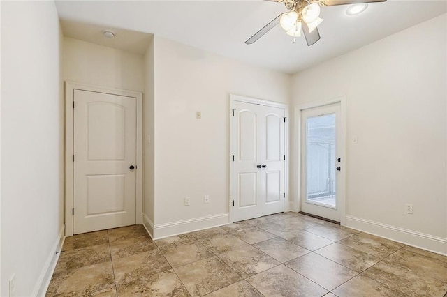 interior space featuring ceiling fan