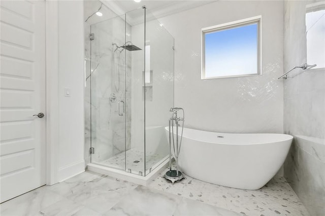 bathroom with crown molding and independent shower and bath