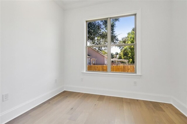 spare room featuring light wood-type flooring