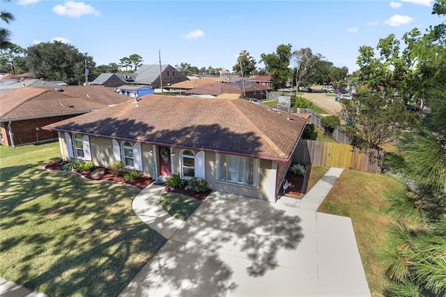 ranch-style house with a front lawn