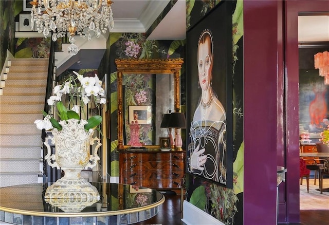 dining room with crown molding, wood-type flooring, and an inviting chandelier