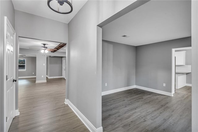 corridor with dark wood-type flooring