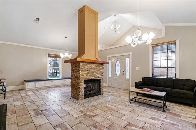 living room with ornamental molding, a fireplace, high vaulted ceiling, and an inviting chandelier