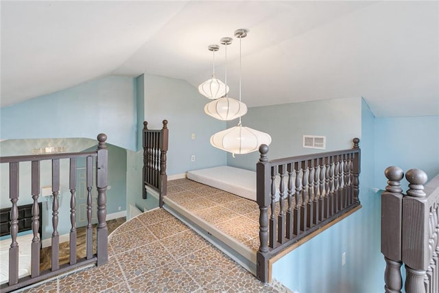 staircase with lofted ceiling