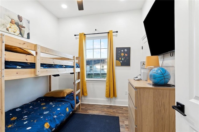 bedroom featuring dark wood-type flooring and ceiling fan