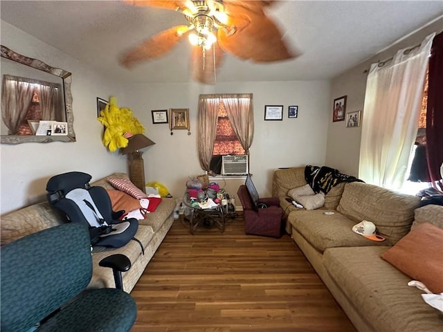 living room with ceiling fan, cooling unit, and hardwood / wood-style flooring