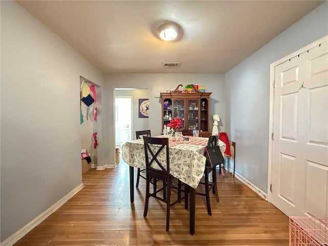 dining area featuring wood-type flooring