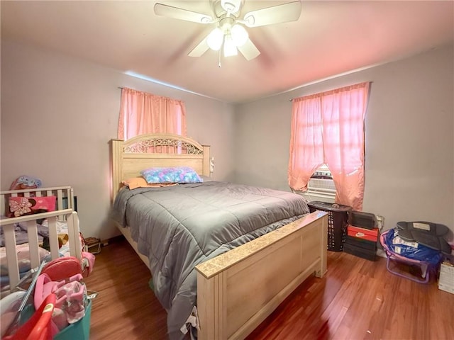 bedroom featuring ceiling fan and hardwood / wood-style flooring