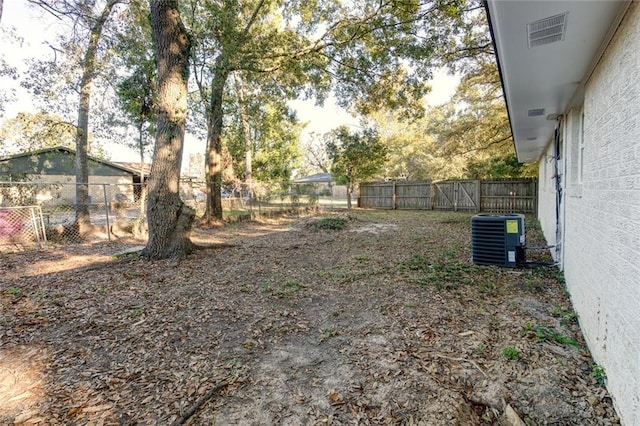 view of yard with central AC unit