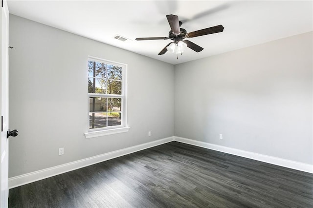 empty room featuring ceiling fan and dark hardwood / wood-style floors