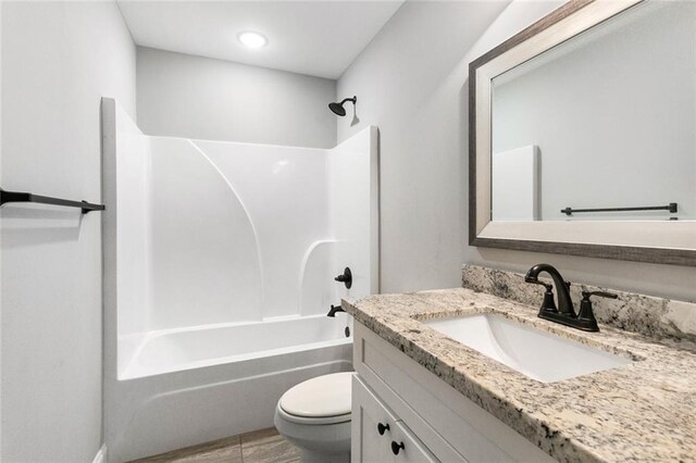 full bathroom with vanity, toilet, and shower / tub combination