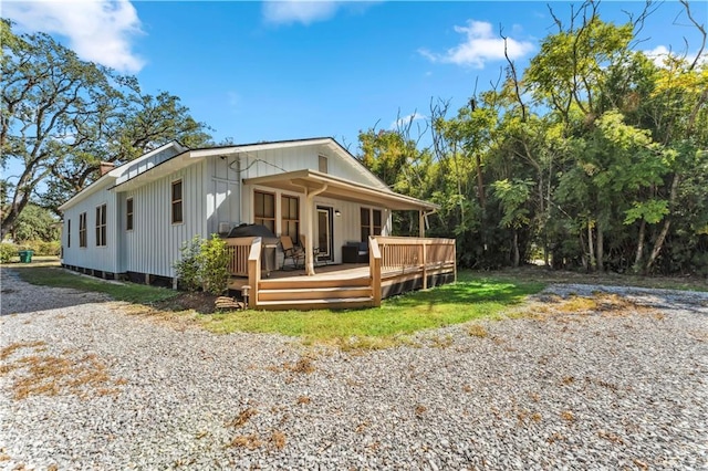 view of front of property with a wooden deck