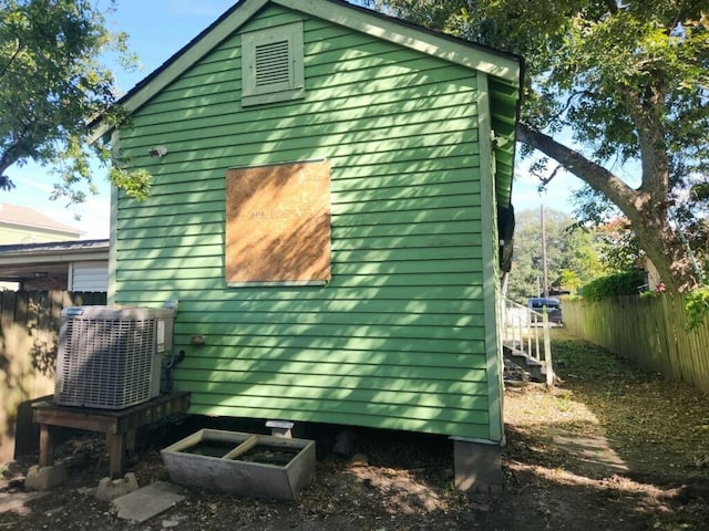 view of side of property featuring cooling unit