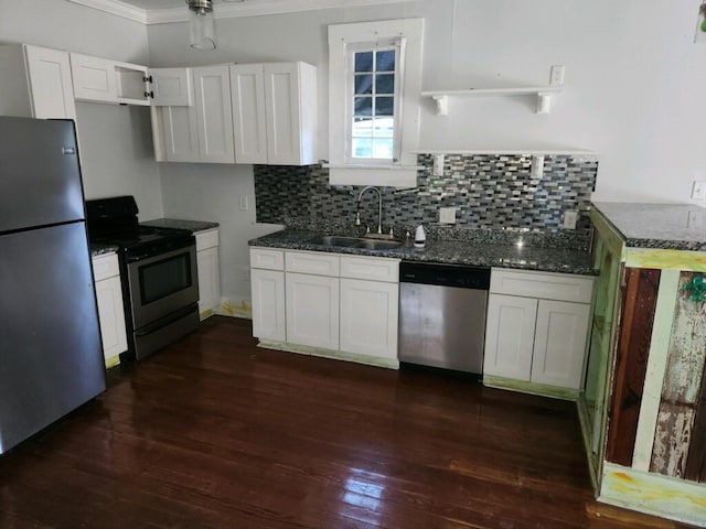 kitchen featuring ornamental molding, sink, appliances with stainless steel finishes, and white cabinets