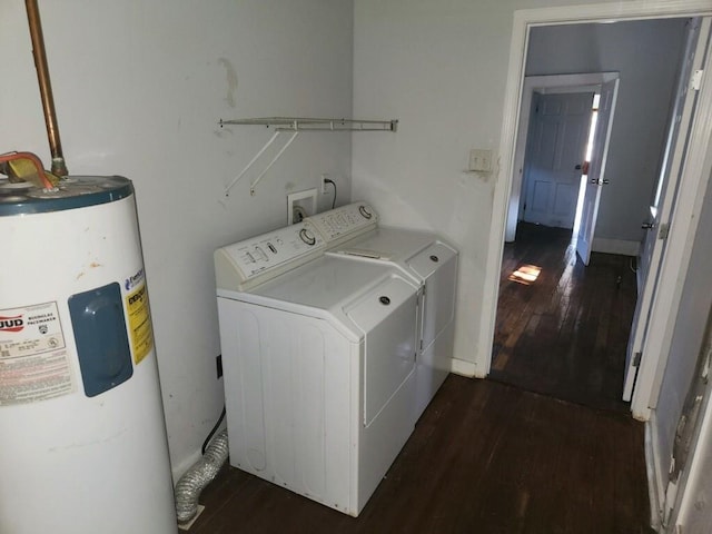 laundry room featuring dark wood-type flooring, water heater, and hookup for a washing machine