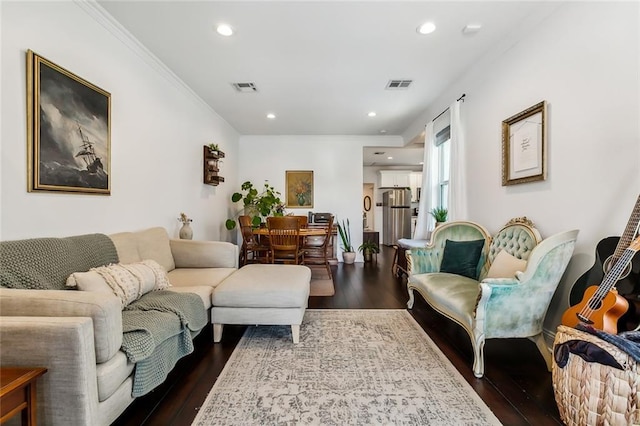 living room with crown molding and dark hardwood / wood-style floors