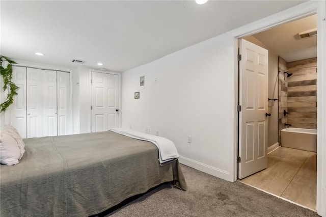 bedroom with light carpet and a closet