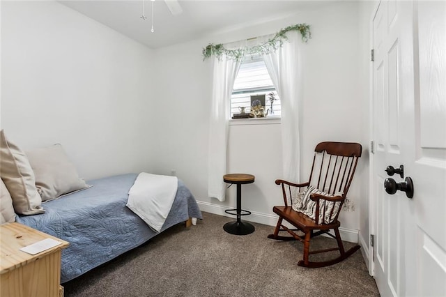 bedroom featuring ceiling fan and dark carpet