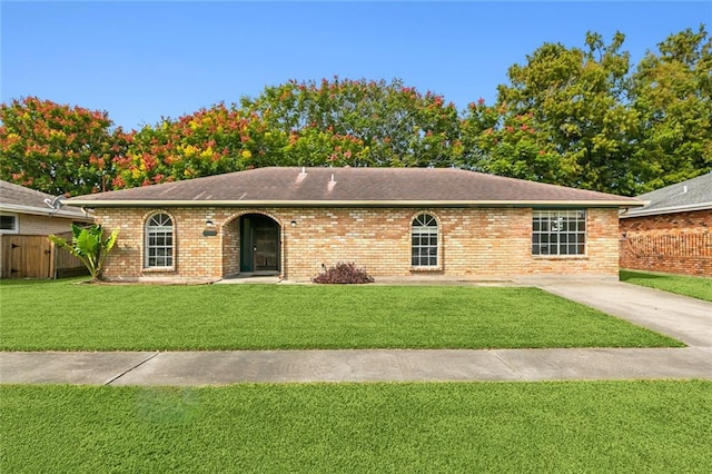 ranch-style house with a front yard