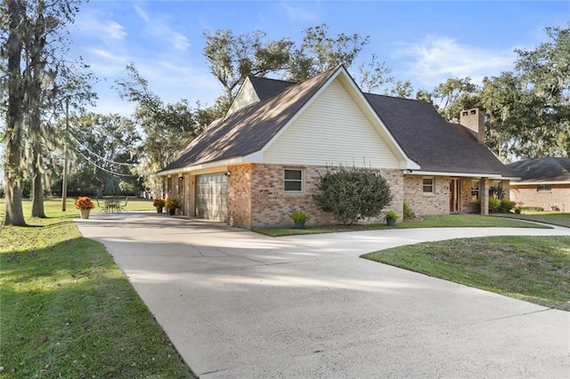 view of side of home featuring a yard and a garage