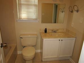 bathroom with vanity, toilet, and tile patterned floors