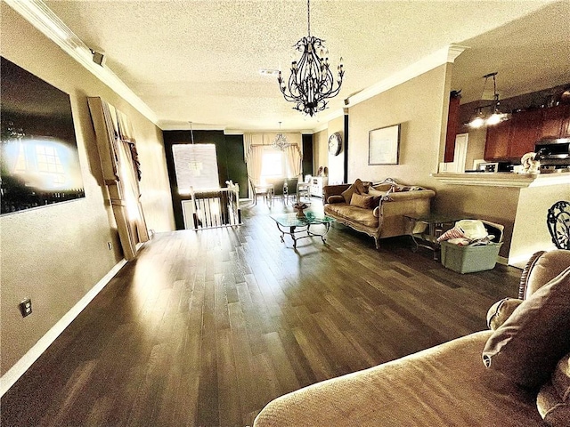 living room featuring ornamental molding, a textured ceiling, dark wood-type flooring, and a notable chandelier