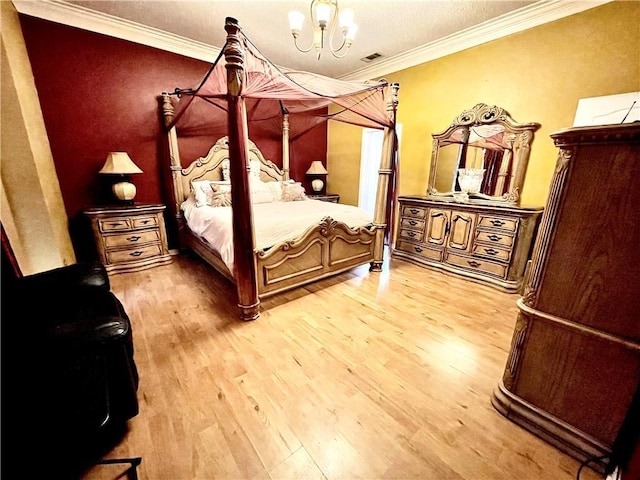 bedroom with a notable chandelier, light wood-type flooring, and crown molding