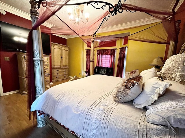 bedroom with a notable chandelier and ornamental molding