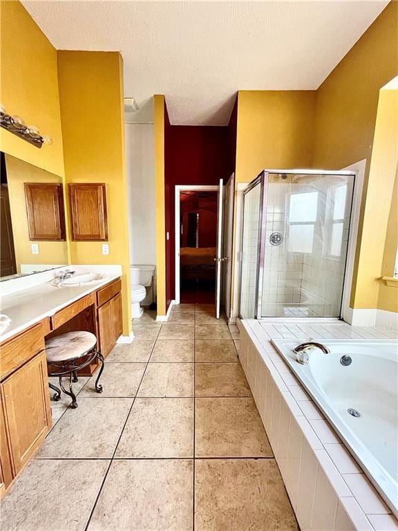 full bathroom featuring vanity, plus walk in shower, tile patterned flooring, toilet, and a textured ceiling