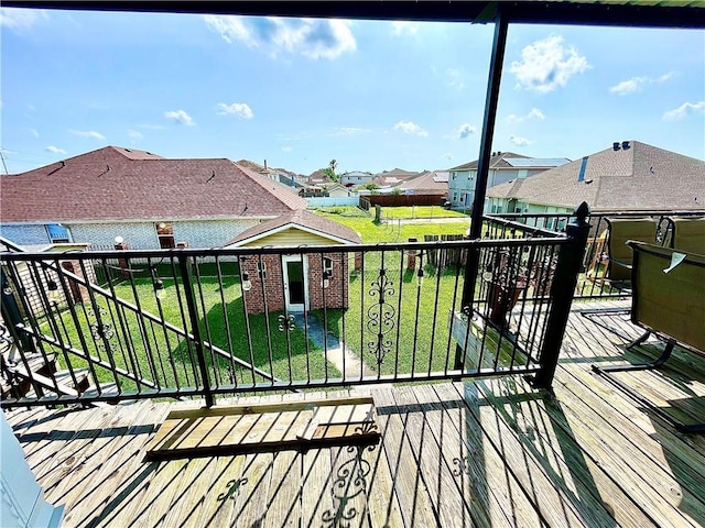 wooden terrace with a yard