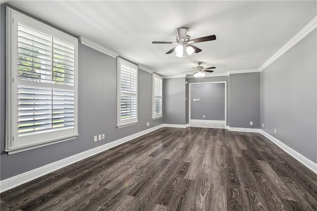 empty room featuring dark hardwood / wood-style flooring, crown molding, ceiling fan, and a wealth of natural light