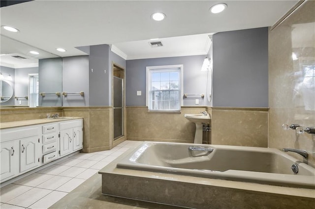 bathroom with vanity, crown molding, plus walk in shower, and tile patterned floors