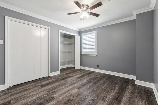 unfurnished bedroom with ornamental molding, dark wood-type flooring, and ceiling fan