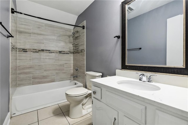 full bathroom featuring vanity, tiled shower / bath combo, toilet, and tile patterned floors