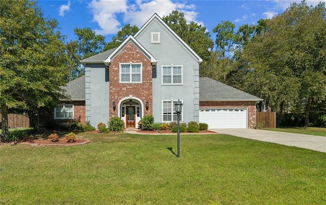 traditional-style home featuring a garage, brick siding, fence, a front lawn, and concrete driveway