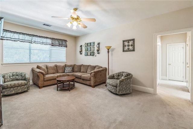 living room with carpet floors, ceiling fan, baseboards, and visible vents