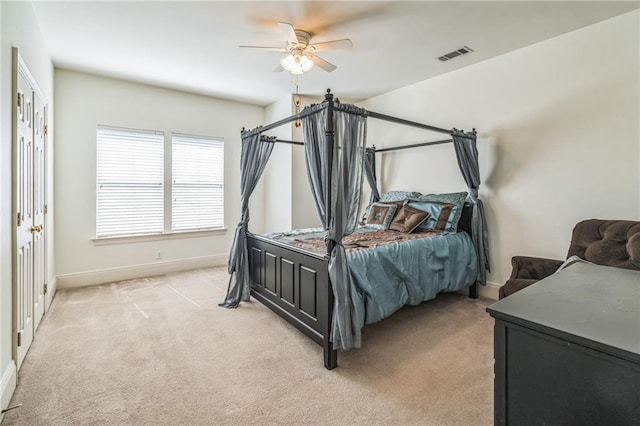 carpeted bedroom with ceiling fan