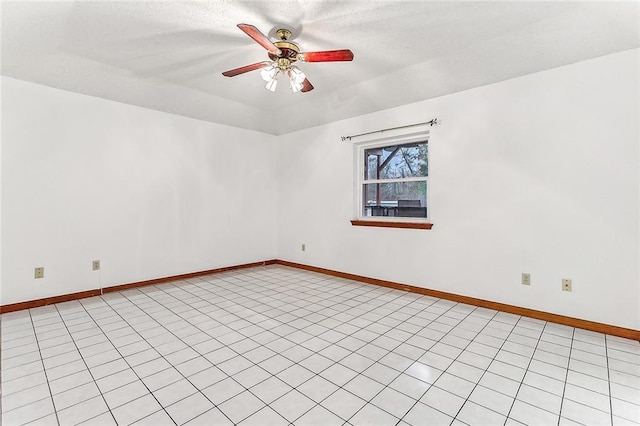 tiled empty room with ceiling fan