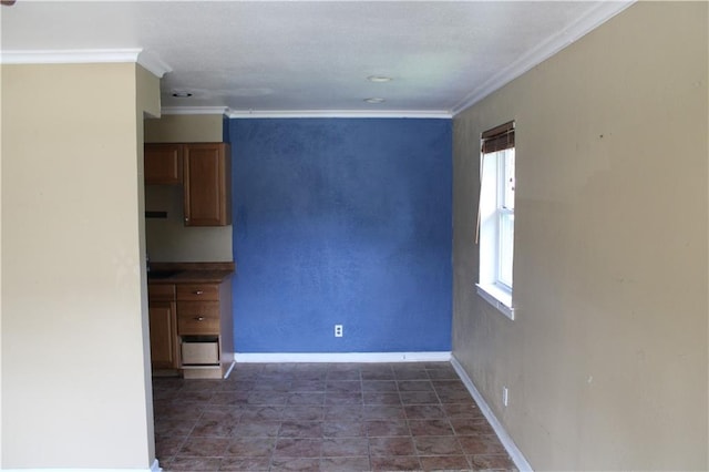 unfurnished room featuring crown molding