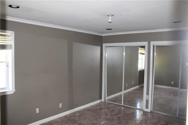 unfurnished bedroom featuring ornamental molding