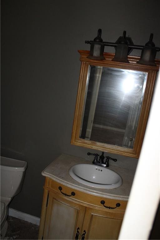 bathroom with vanity and toilet