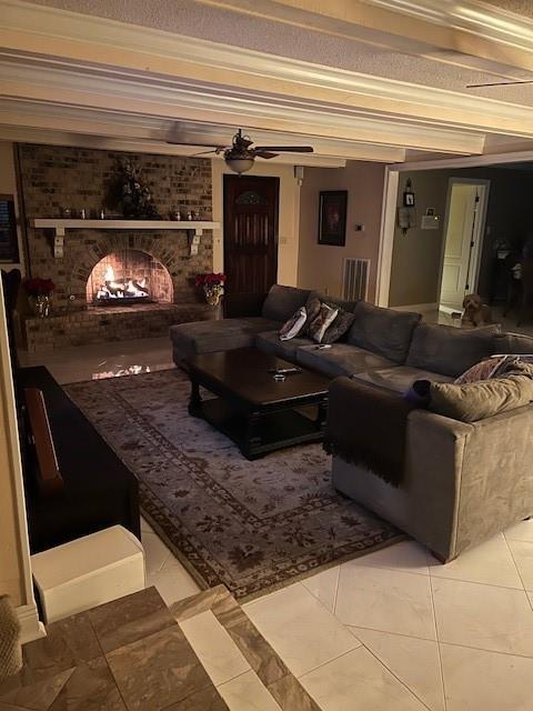11051 Lake Forest Blvd, New Orleans, LA 70127 - living area with a brick fireplace, ceiling fan, and light tile patterned floors