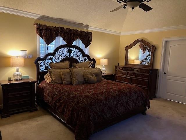 carpeted bedroom with ornamental molding, vaulted ceiling, a textured ceiling, and ceiling fan