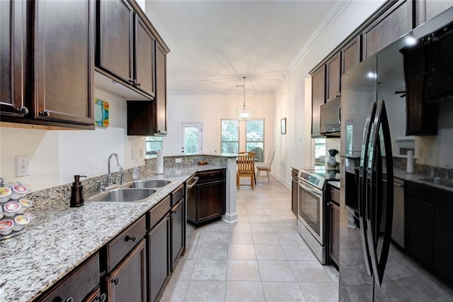 kitchen featuring hanging light fixtures, sink, crown molding, dark brown cabinetry, and stainless steel appliances